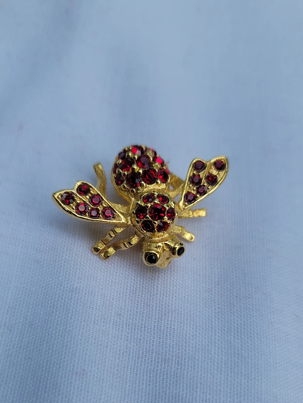 Vintage Joan Rivers Gold Bee Brooch with Red Crystals